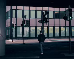 Permission A lone figure crosses beneath layers of concrete and glass, guided by quiet signals in an indifferent city.